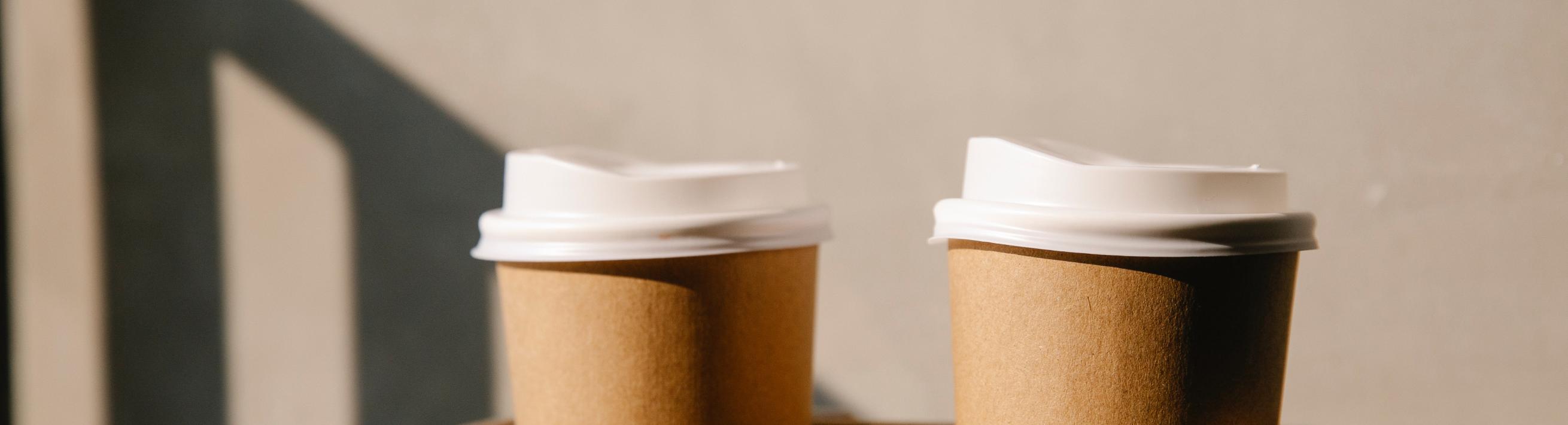 Two single-use coffee cups