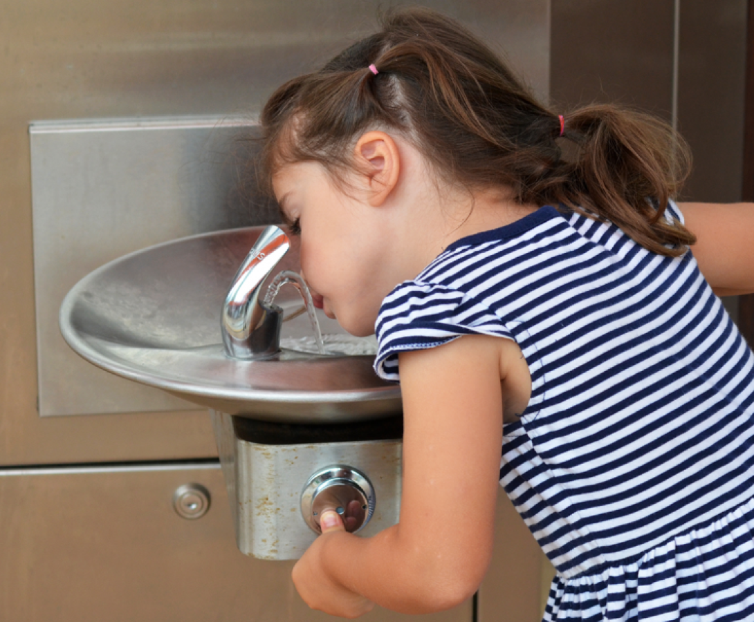 Filter First, child at drinking fountain