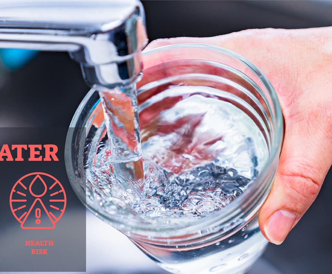Water running from tap into glass