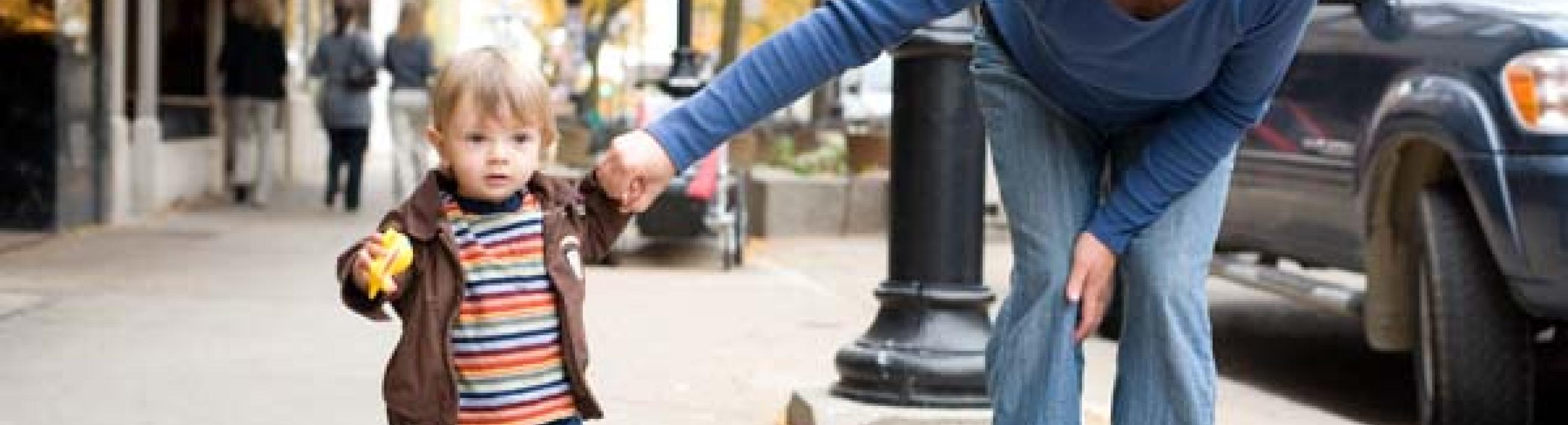 Woman and boy on sidewalk