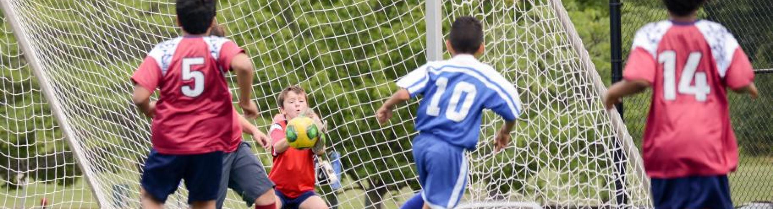 young people playing soccer