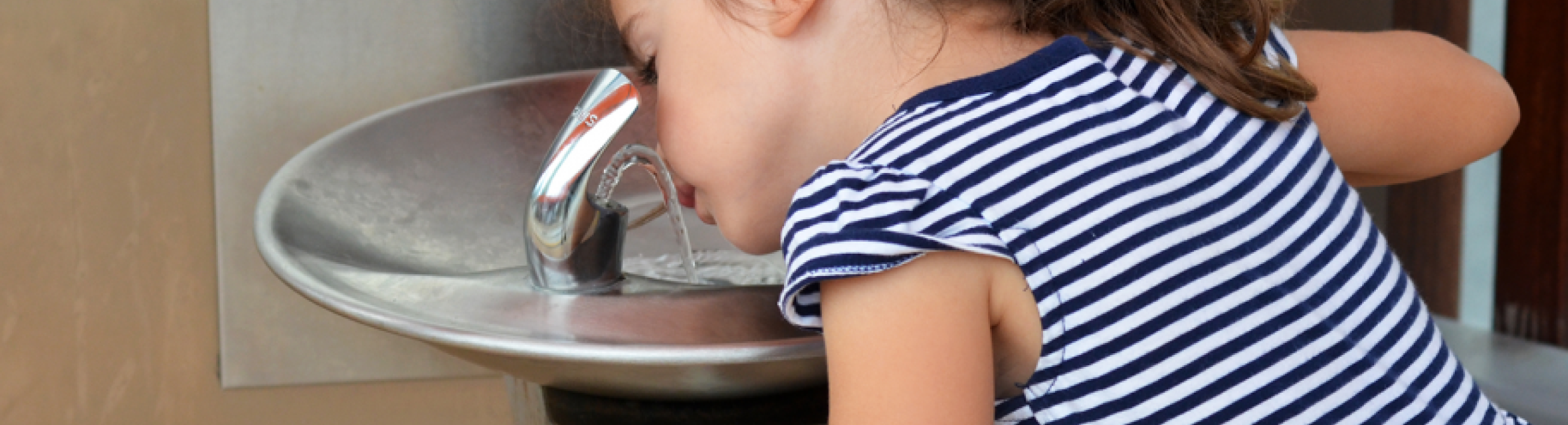 Filter First, child at drinking fountain