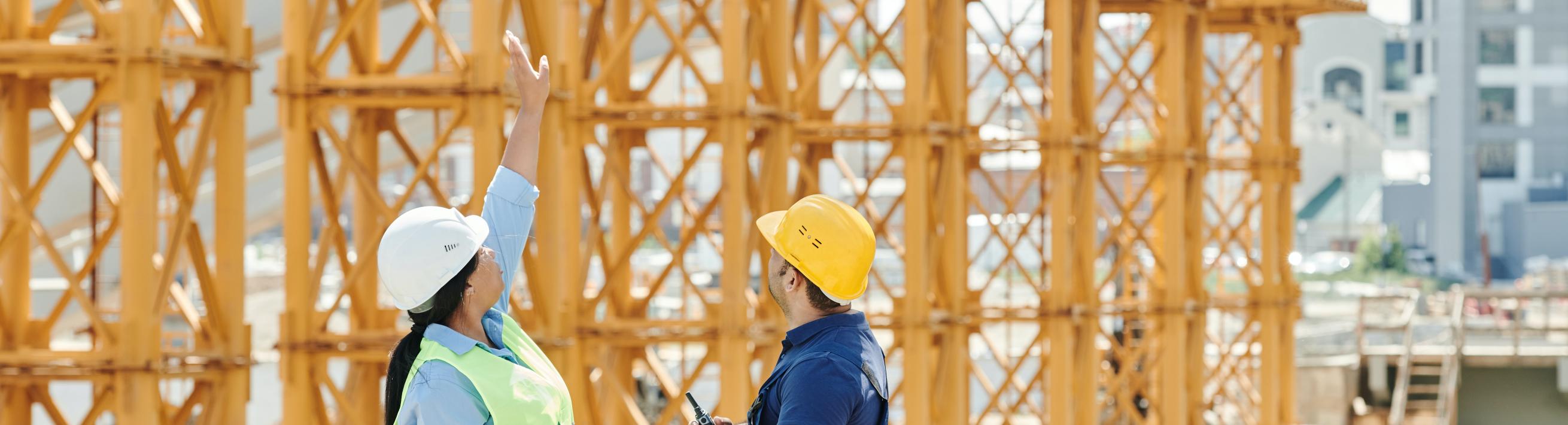 Two people at a construction site