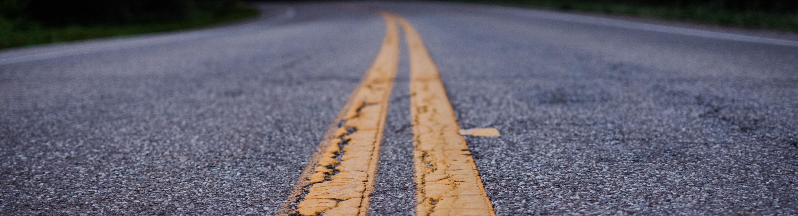 Concrete pavement with two parallel yellow lines