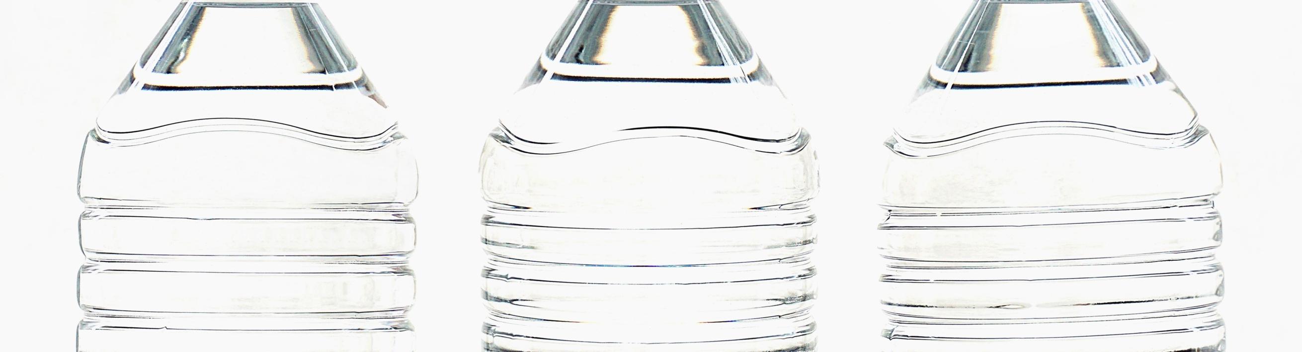 Three plastic water bottles