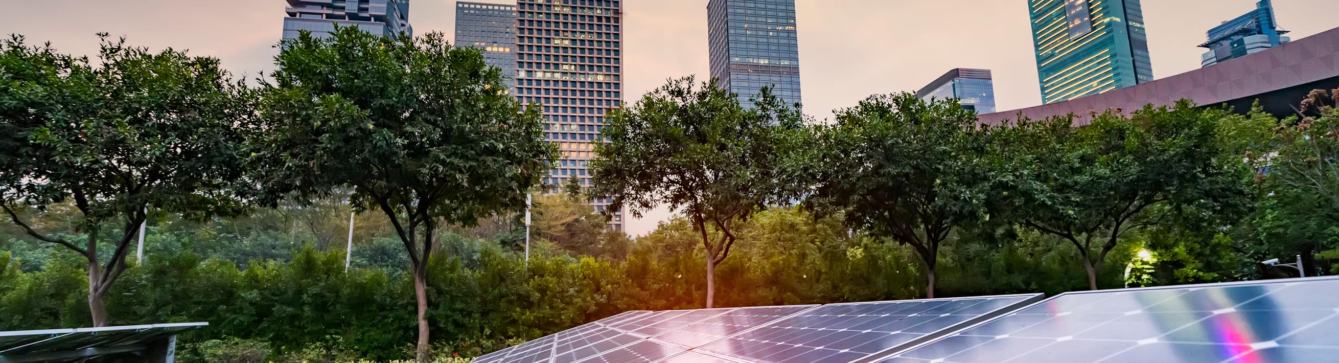 clean energy; solar panels with city in background