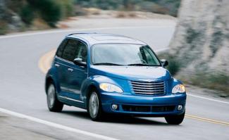 Chrysler PT Cruiser traveling down a winding road