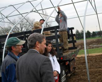 Pictured are St. Joseph Mercy CEO Rob Casalou; Dave Raymond, who is overseeing hoop house construction; head of nutrition at St. Joseph Lisa McDowell; Mike Score; and J.P. Swanson.
