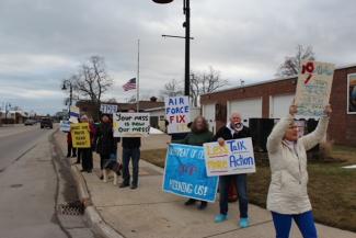 Group of community members from Oscoda Michigan protesting about PFAS contamination