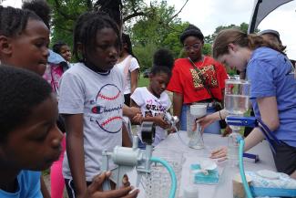 Kids testing water for microplastics