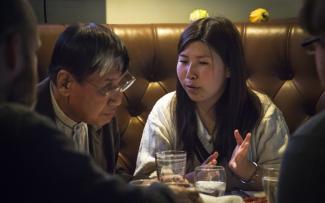 photo of Yuki translating for Toshio Iizuka