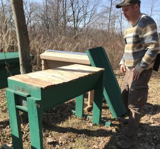 Miller working on a top bar beehive construction project