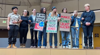 WMU students attend Solidarity Stand, linking arms with other students and professors to show support for rational leadership, climate action, and everyone in their community