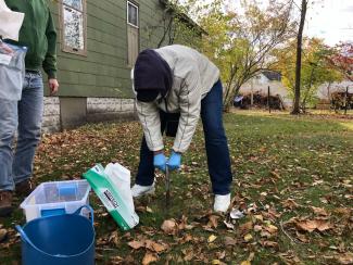Erica Bloom sampling soil for PFAS testing