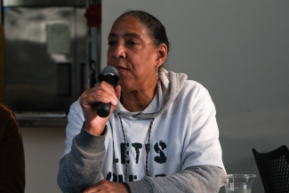 Theresa Landrum speaking at a Clear the Air event