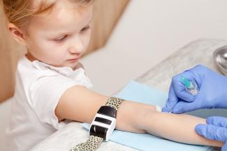 Child getting a blood test for lead levels